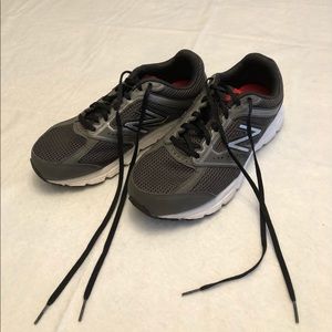 Mens New Balance running shoes. Dark gray. Size 8.
